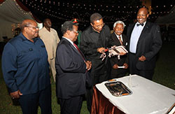 Picture #3 President Kikwete receiving the book in the presence of Sir George (2d from the left), his son Joseph Kahama ,the author, and former presidents Benjamin Mkapa and Hassan Mwinyi. Maria Nyerere is not visible in this photo.