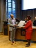 The official moment: Dr Muhammad Juma presents the first copy of the Ng'ambo Atlas to the Ambassador of Tanzania to the Netherlands, H.E. Irene Kasyanju.